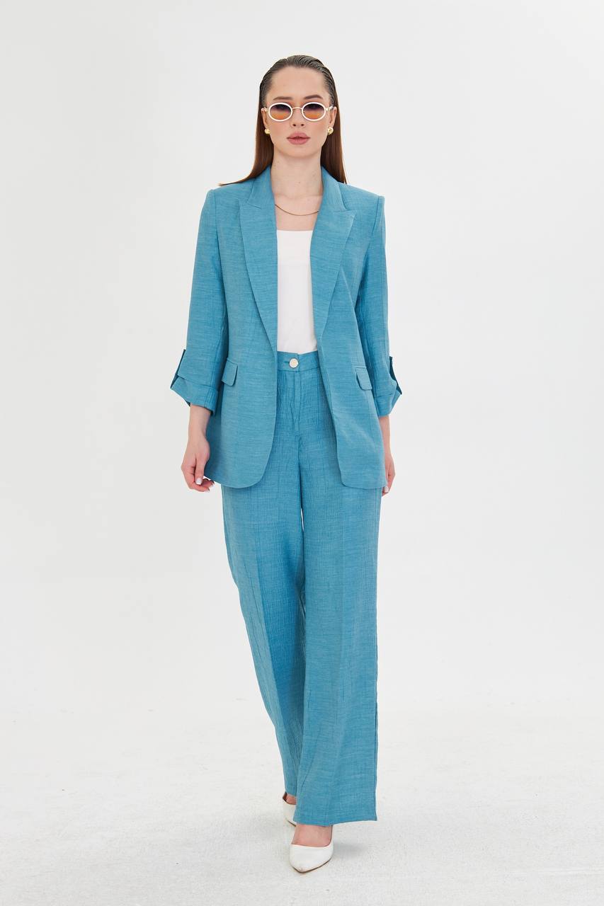 Woman wearing a blue suit on a white background
